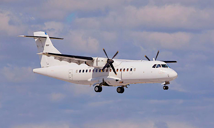 White body propeller aircraft in flight